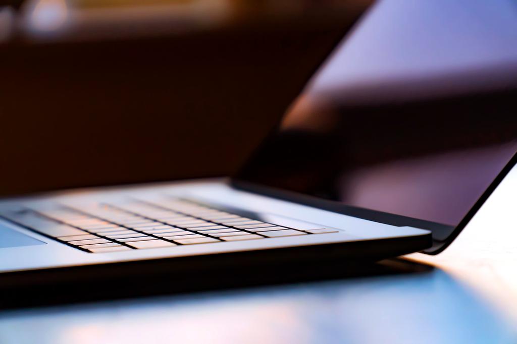 Modern digital marketing workspace with laptops, analytics dashboards, and creative tools
